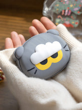 ZOA hand warmer held in hand